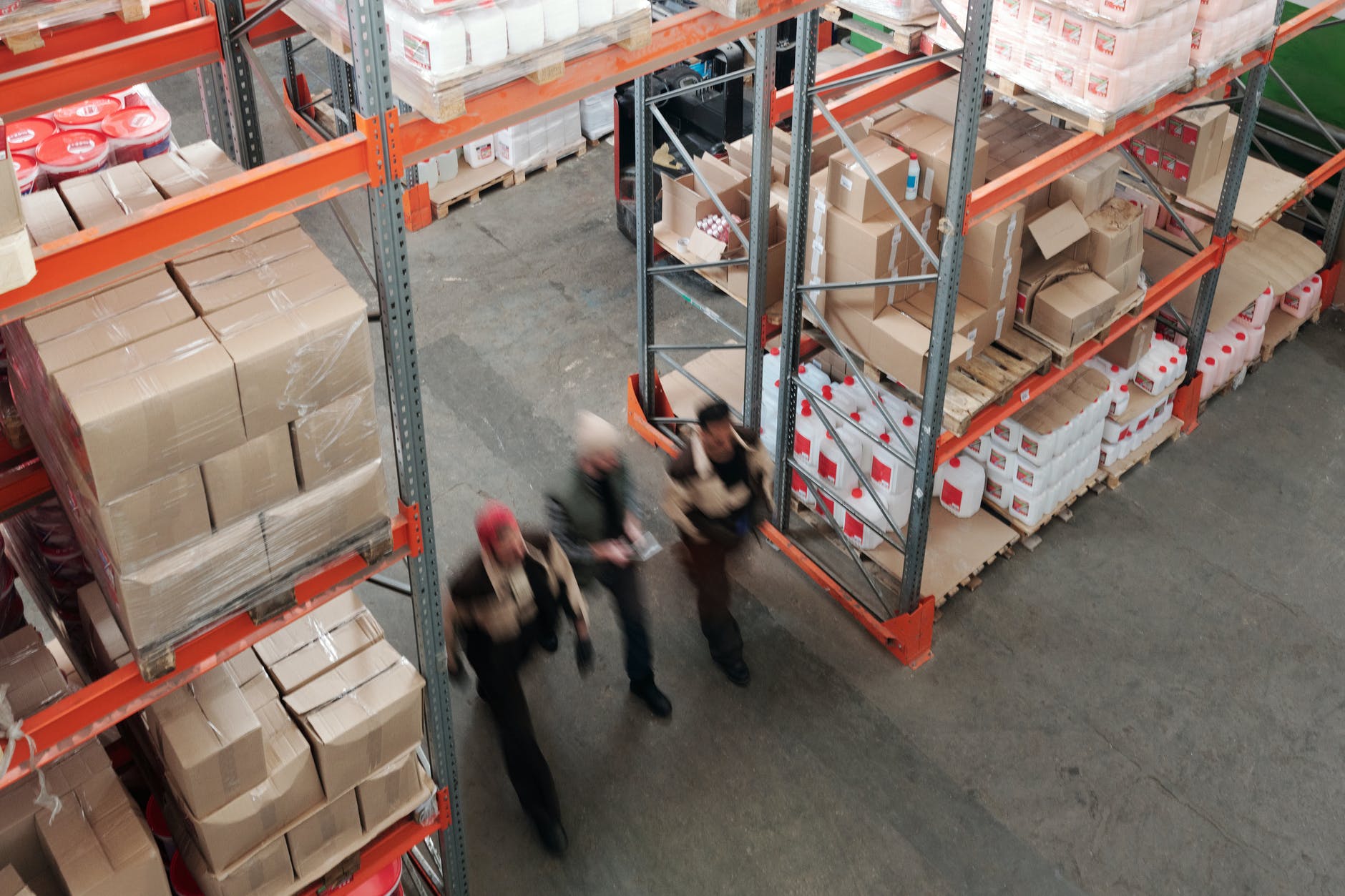 Warehouse workers move inventory much like Amazon FBA 